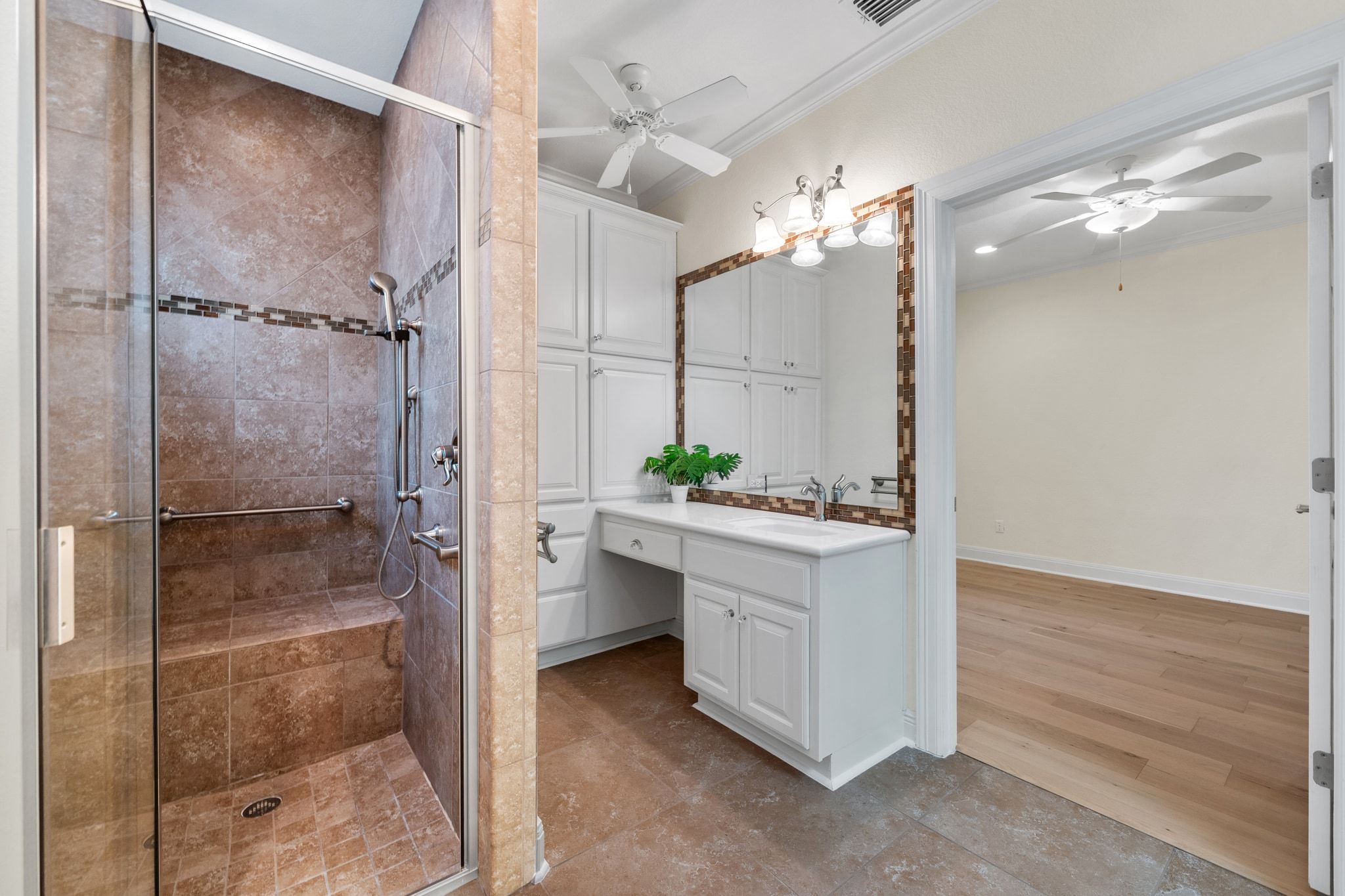 3701 Copper Ridge Court Austin, TX 78734 - Photo 23 of 30 a bathroom with a shower and a sink