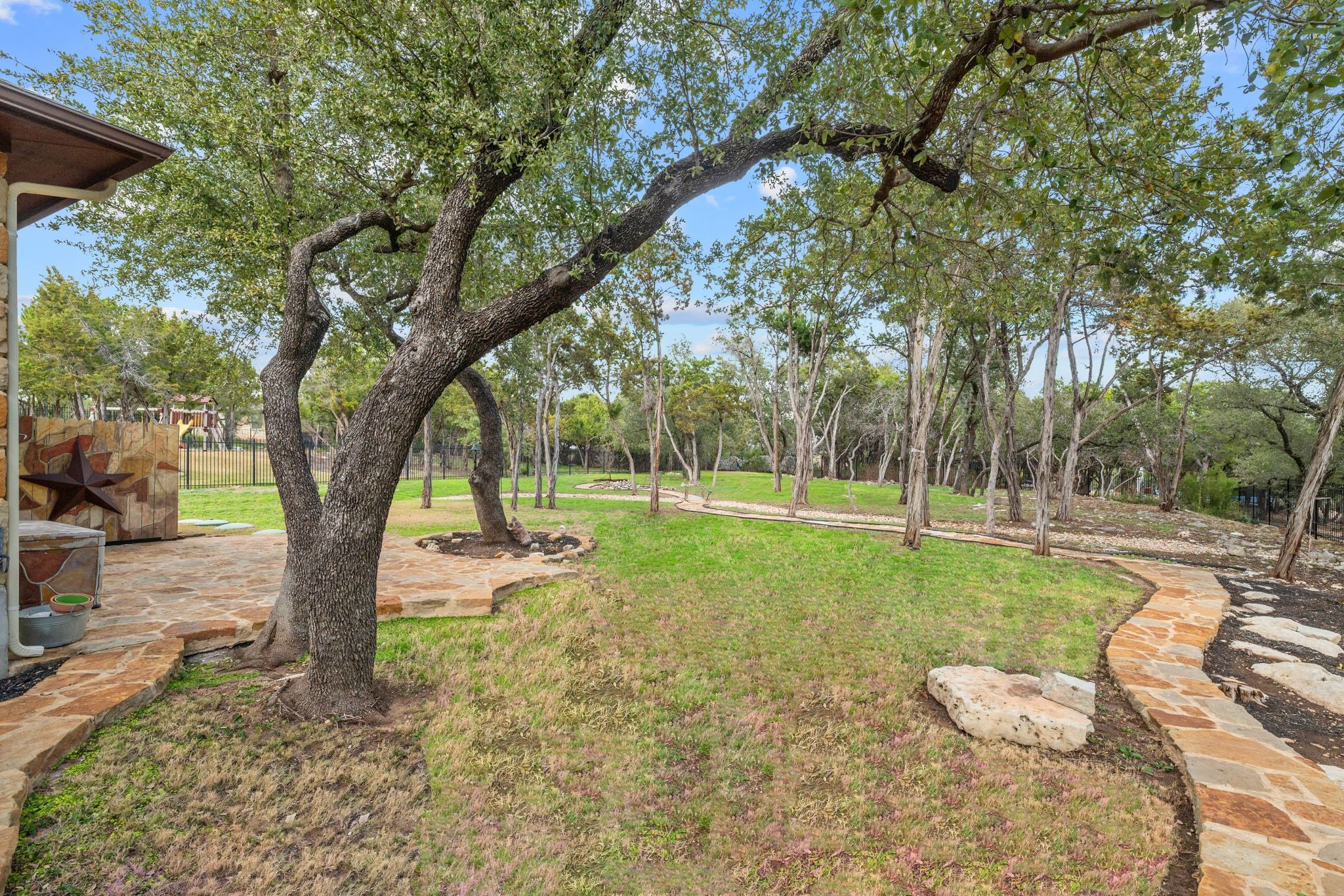 3701 Copper Ridge Court Austin, TX 78734 - Photo 25 of 30 a view of a yard with slide