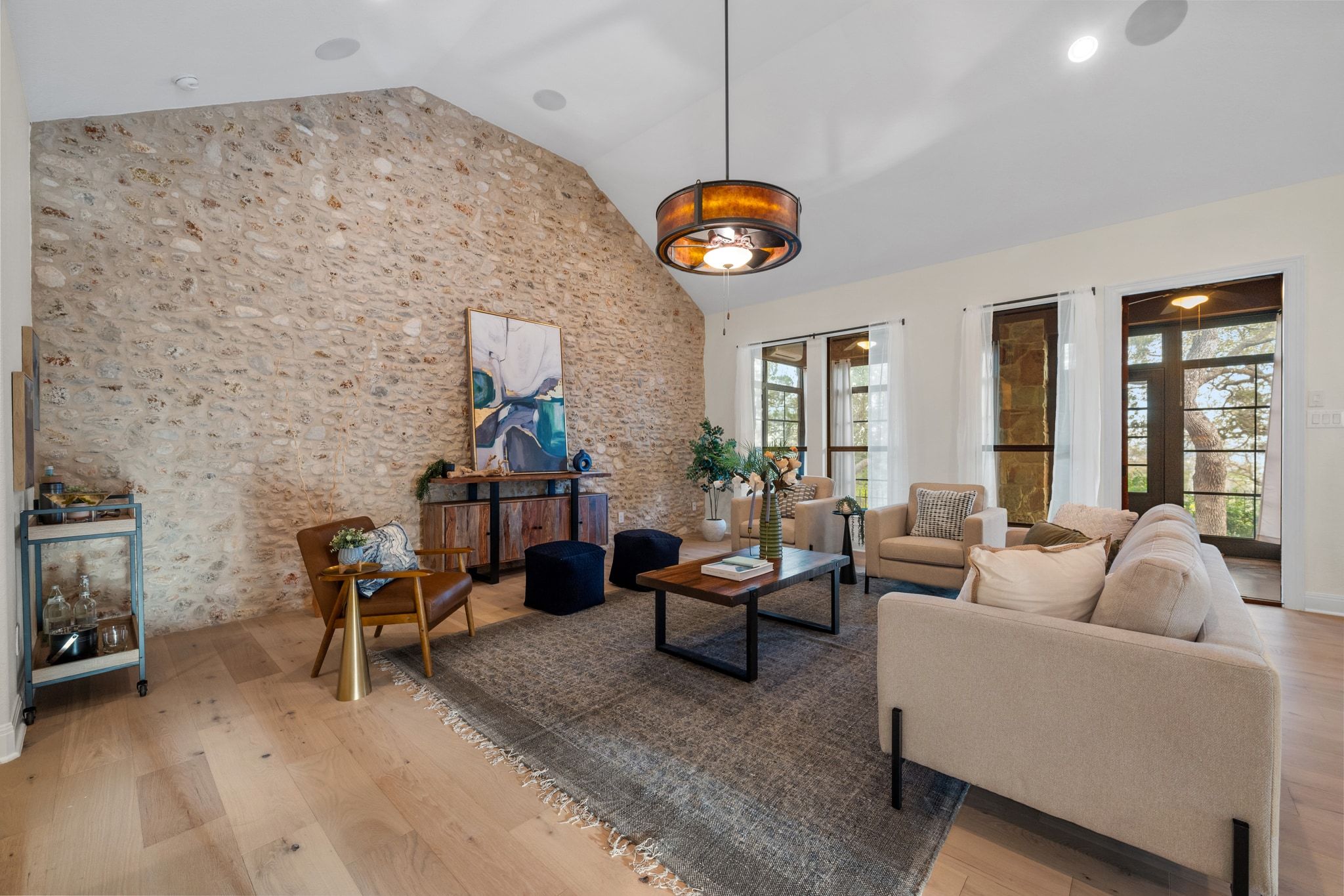 3701 Copper Ridge Court Austin, TX 78734 - Photo 6 of 30 a living room with fireplace furniture and a large window