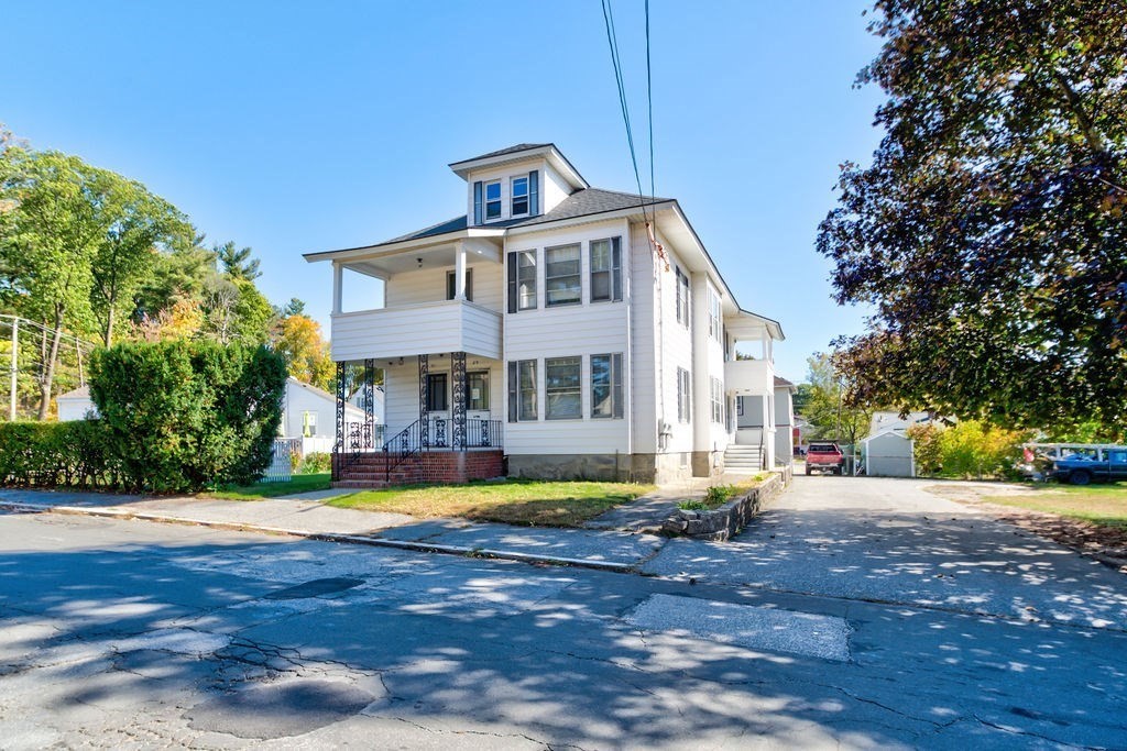 89-91 Larchwood Road Methuen, MA 01844 - Photo 1 of 39 a front view of a house with swimming pool