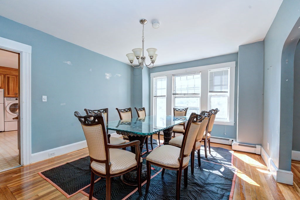 89-91 Larchwood Road Methuen, MA 01844 - Photo 11 of 39 a view of a dining room with furniture window and wooden floor