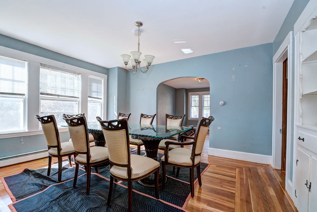 89-91 Larchwood Road Methuen, MA 01844 - Photo 12 of 39 a view of a dining room with furniture window and wooden floor