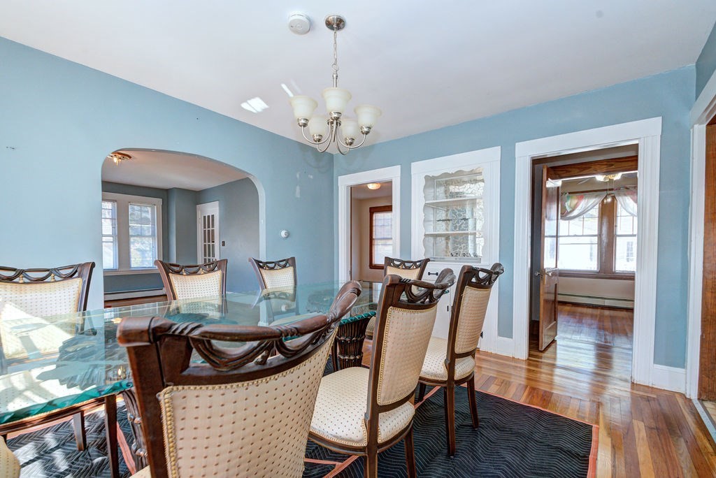 89-91 Larchwood Road Methuen, MA 01844 - Photo 13 of 39 a view of a dining room with furniture window and wooden floor