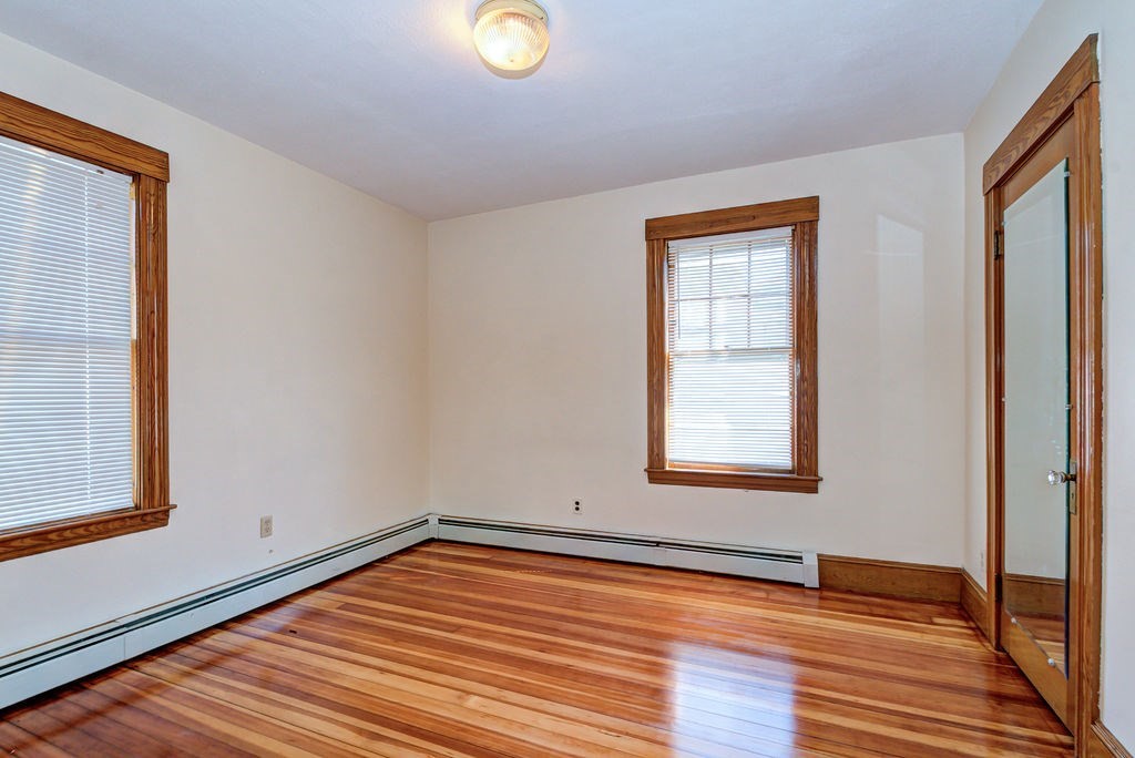 89-91 Larchwood Road Methuen, MA 01844 - Photo 19 of 39 a view of a room with wooden floor and windows