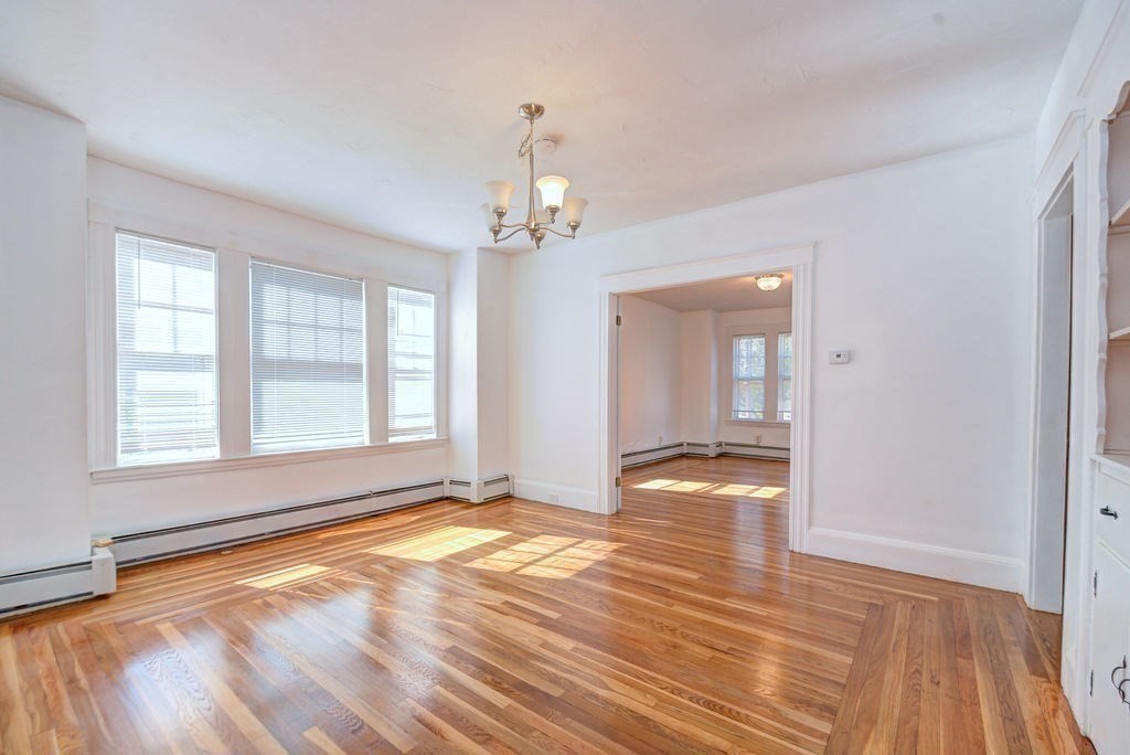 89-91 Larchwood Road Methuen, MA 01844 - Photo 22 of 39 a view of empty room with wooden floor and fan