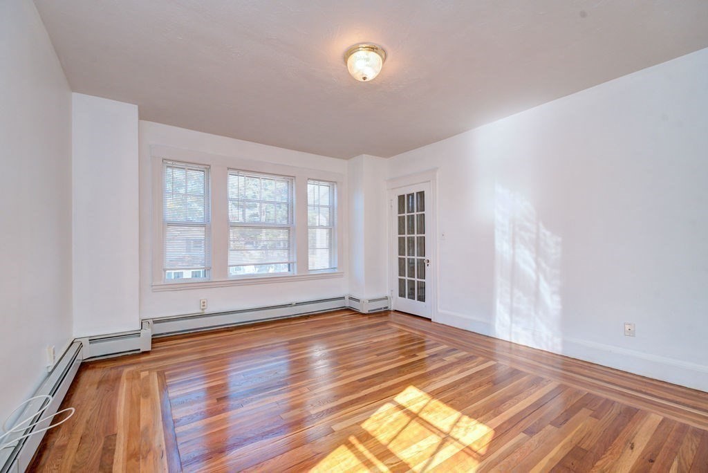 89-91 Larchwood Road Methuen, MA 01844 - Photo 25 of 39 a view of empty room with wooden floor and fan