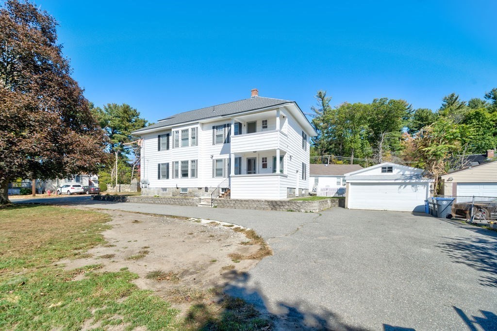 89-91 Larchwood Road Methuen, MA 01844 - Photo 3 of 39 a front view of a house with a yard