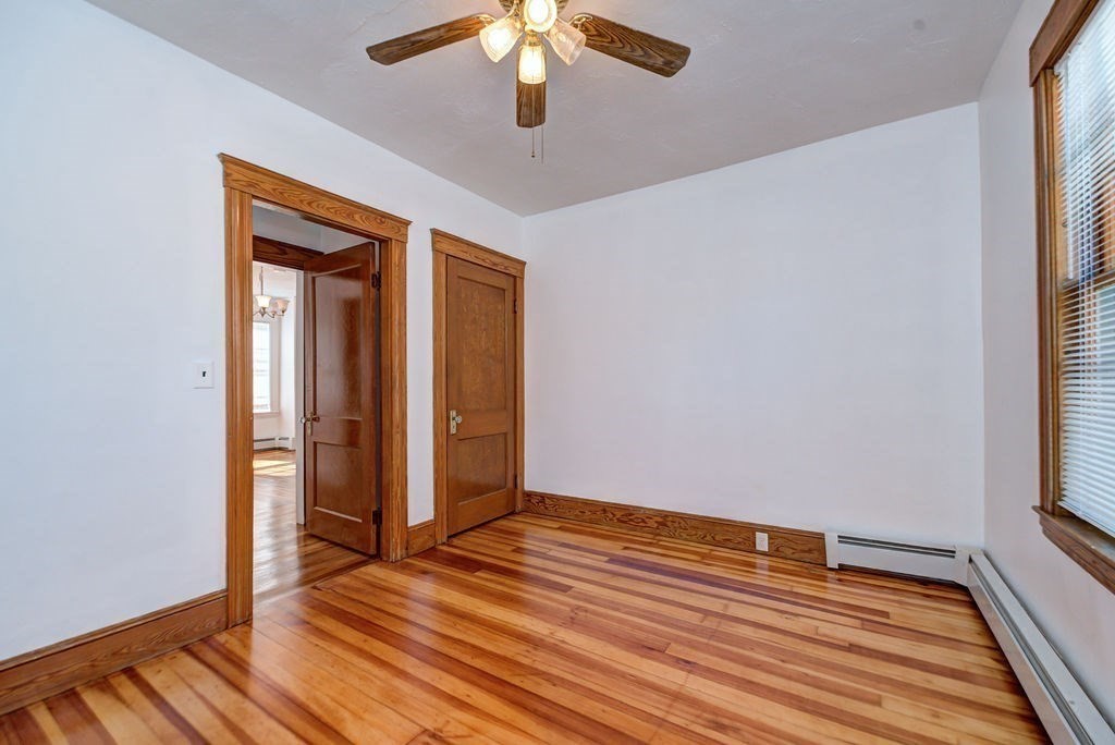 89-91 Larchwood Road Methuen, MA 01844 - Photo 32 of 39 wooden floor in an empty room with a window