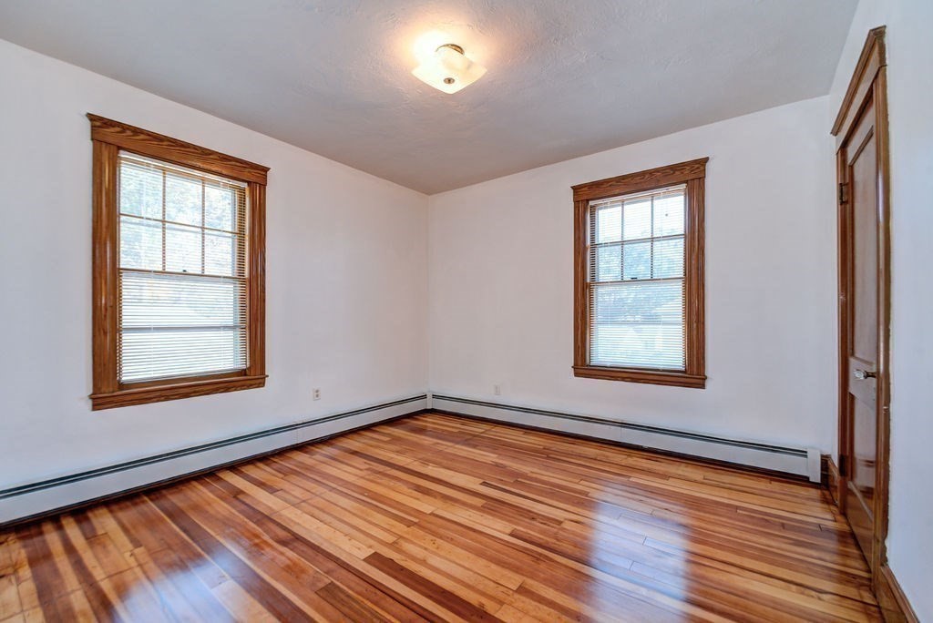 89-91 Larchwood Road Methuen, MA 01844 - Photo 33 of 39 an empty room with wooden floor and windows