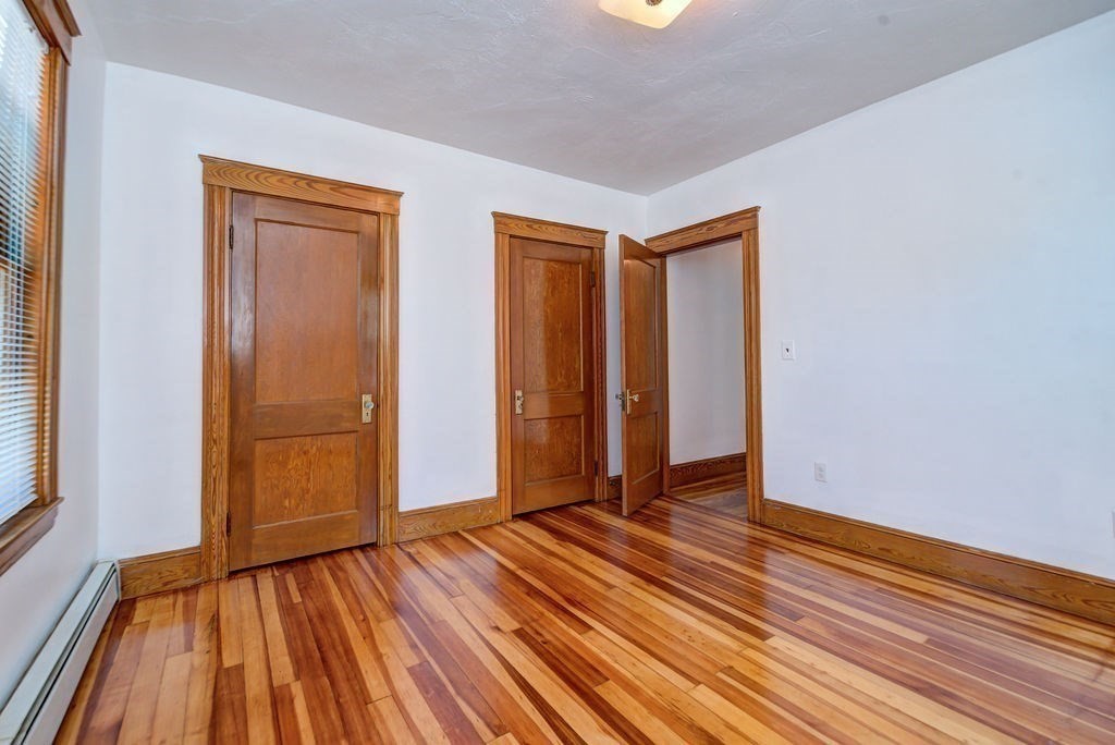 89-91 Larchwood Road Methuen, MA 01844 - Photo 34 of 39 a view of an empty room with wooden floor