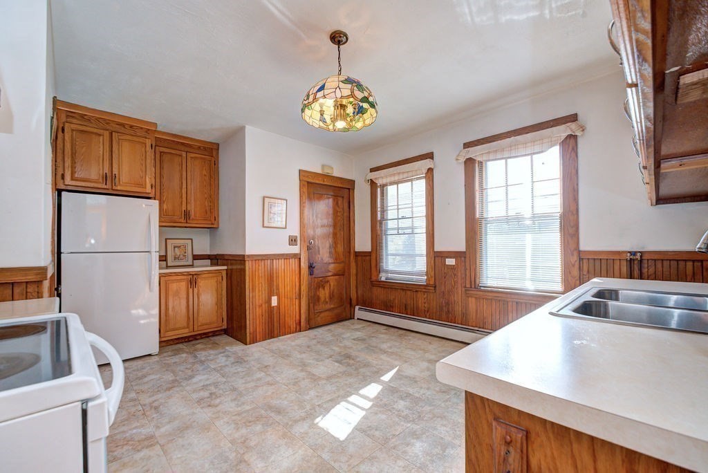 89-91 Larchwood Road Methuen, MA 01844 - Photo 38 of 39 a kitchen with refrigerator and window