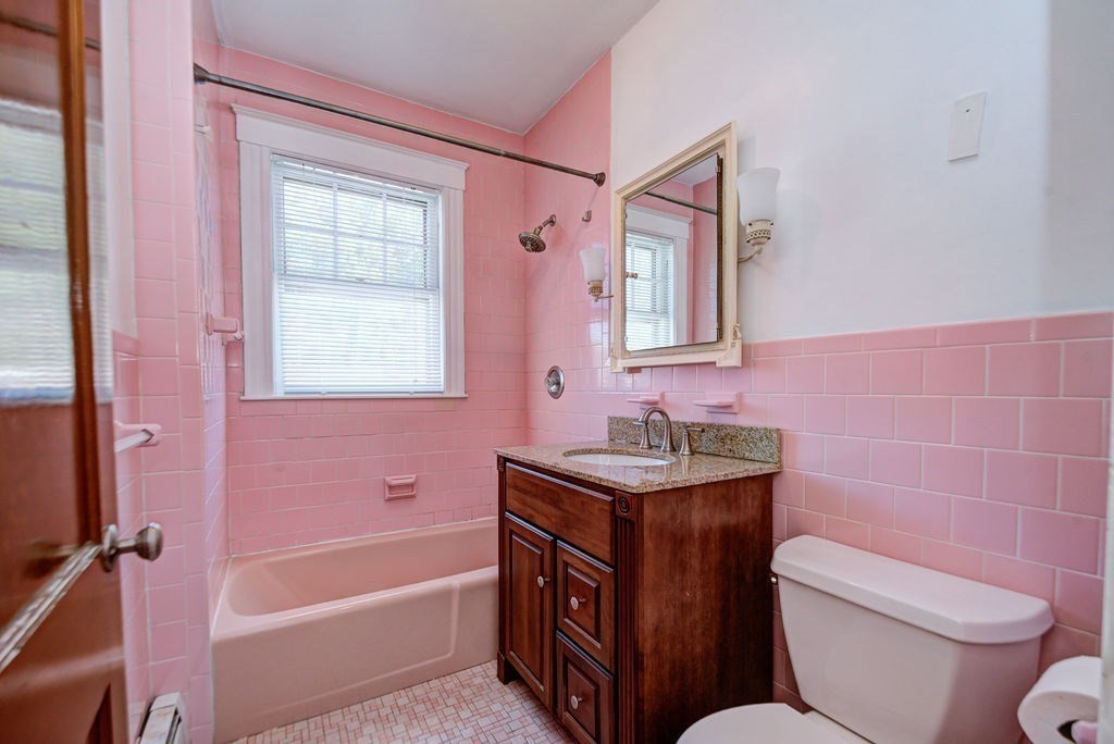 89-91 Larchwood Road Methuen, MA 01844 - Photo 39 of 39 a bathroom with a sink a toilet a mirror and shower