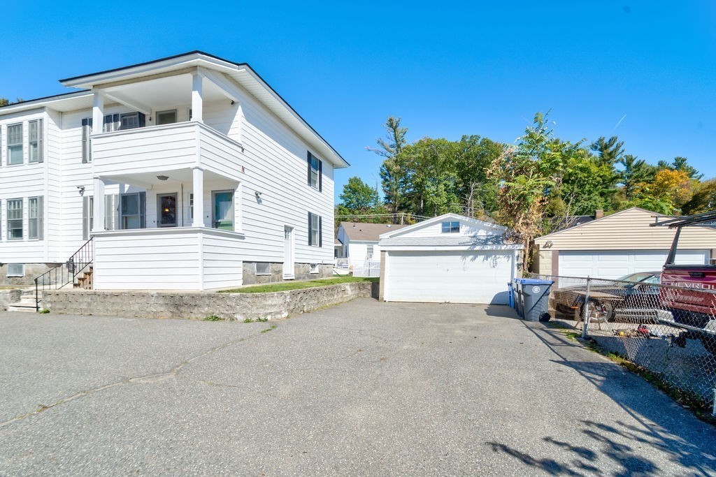 89-91 Larchwood Road Methuen, MA 01844 - Photo 4 of 39 a view of a house with backyard and sitting area