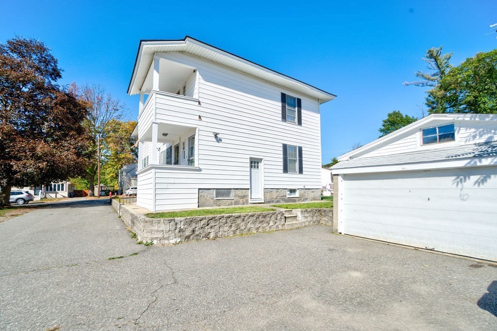 89-91 Larchwood Road Methuen, MA 01844 - Photo 5 of 39 a white house with a outdoor space