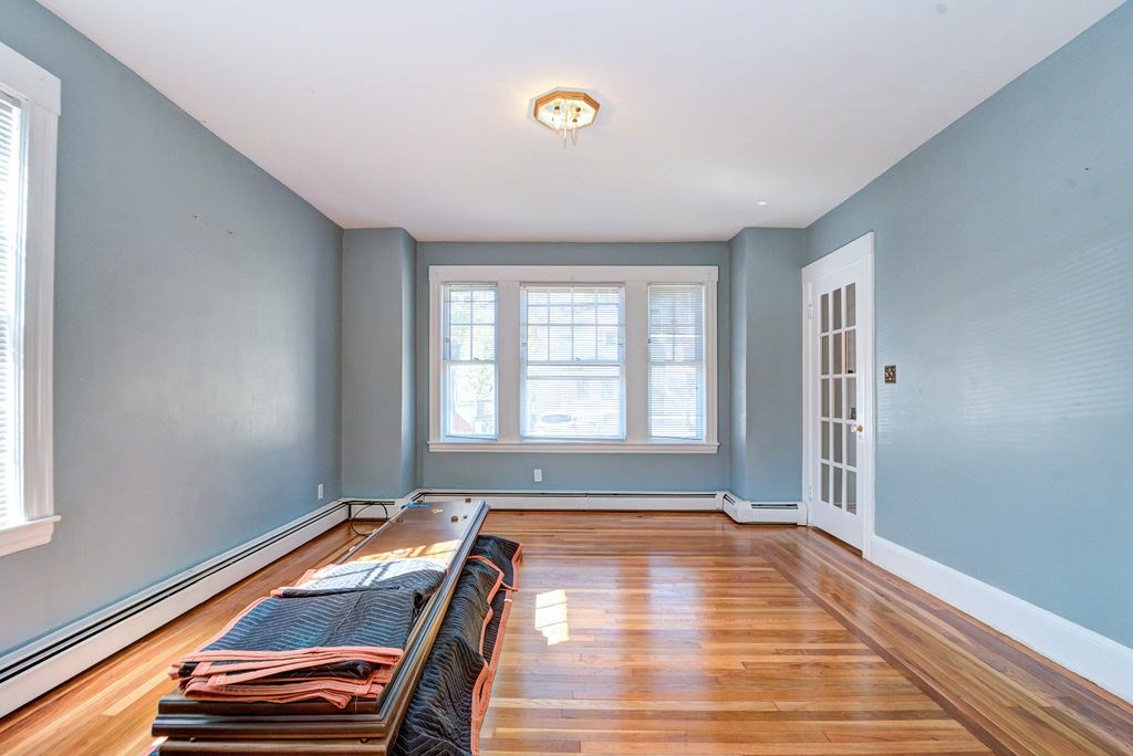 89-91 Larchwood Road Methuen, MA 01844 - Photo 9 of 39 a room with furniture and a window