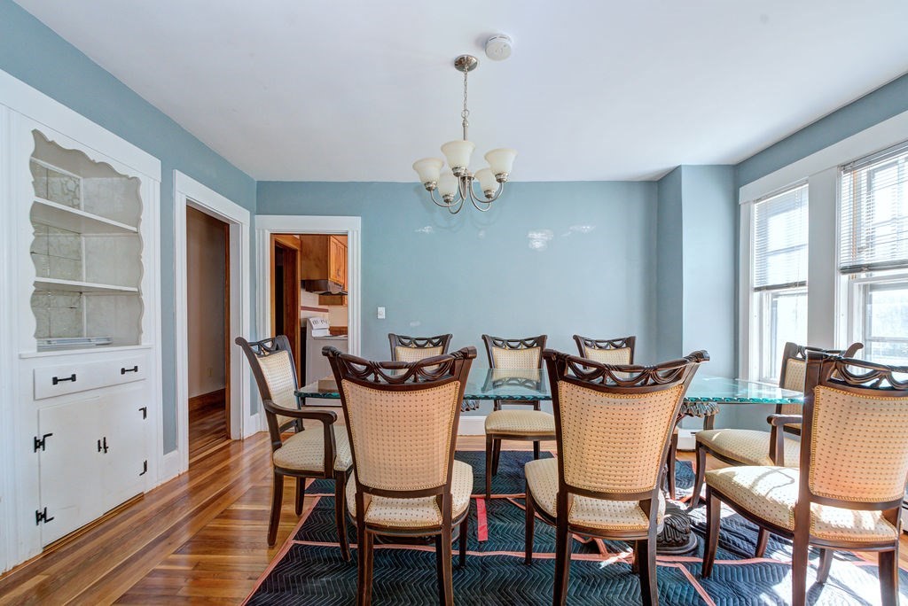 89-91 Larchwood Road Methuen, MA 01844 - Photo 10 of 39 a view of a dining room with furniture a chandelier and wooden floor