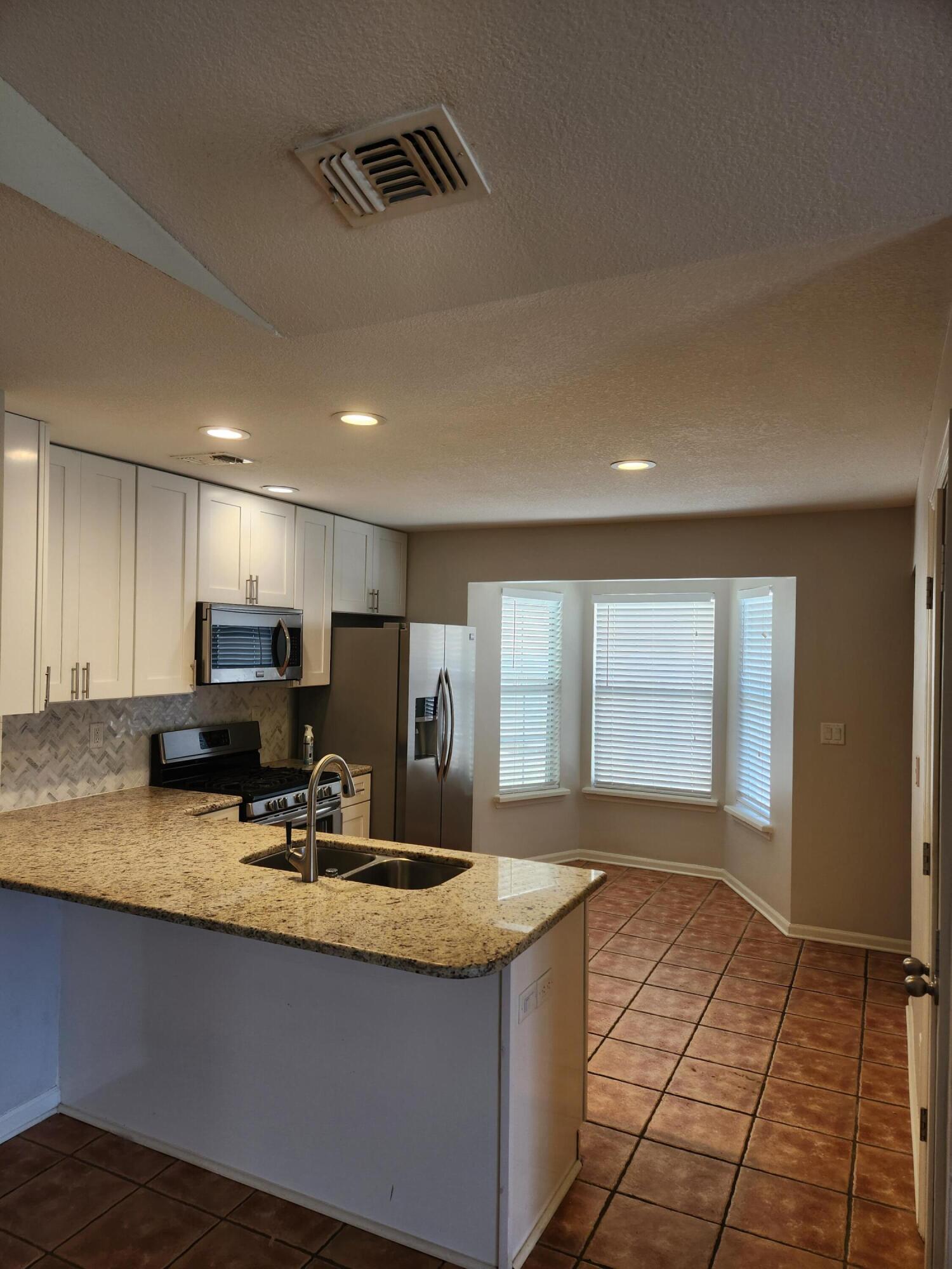 52 Rue D Honfleur Destin, FL 32541 - Photo 3 of 15 a view of kitchen with sink window and refrigerator