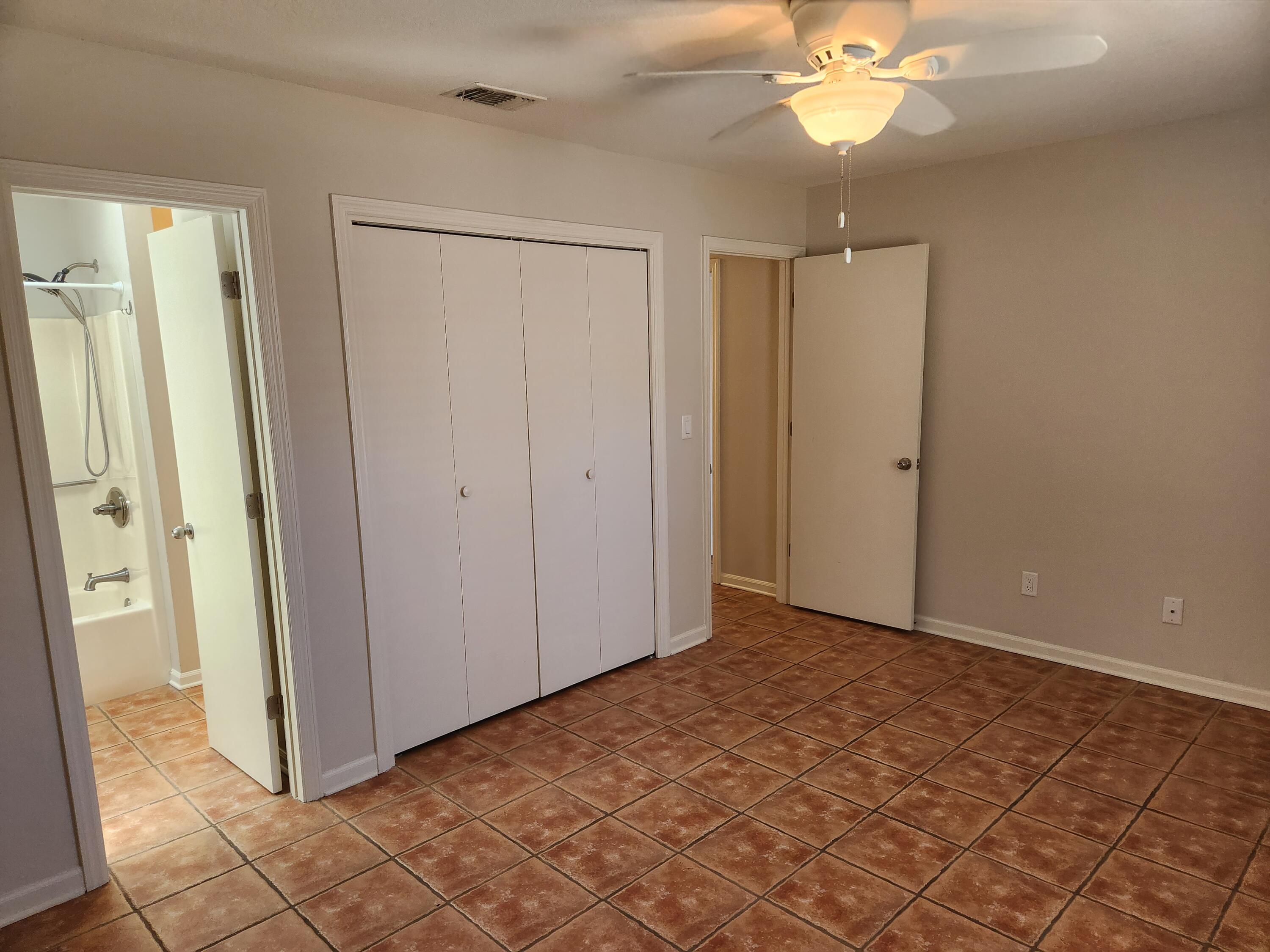 52 Rue D Honfleur Destin, FL 32541 - Photo 10 of 15 an empty room with fan and entrance