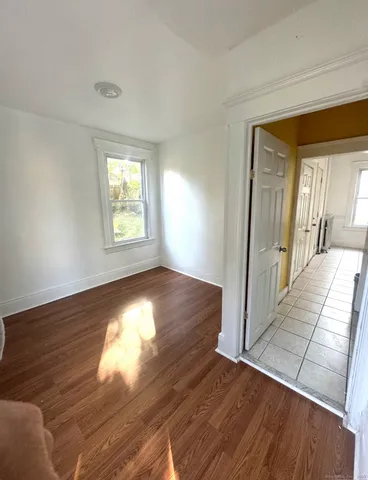 a view of a livingroom with wooden floor