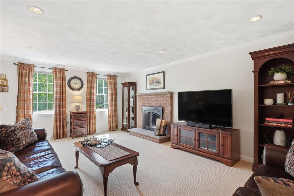 9 Fazio Farm Road Georgetown, MA 01833 - Photo 18 of 42 a living room with furniture and a flat screen tv