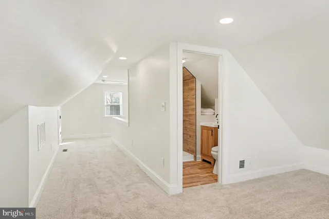 an entryway of a house and an empty room