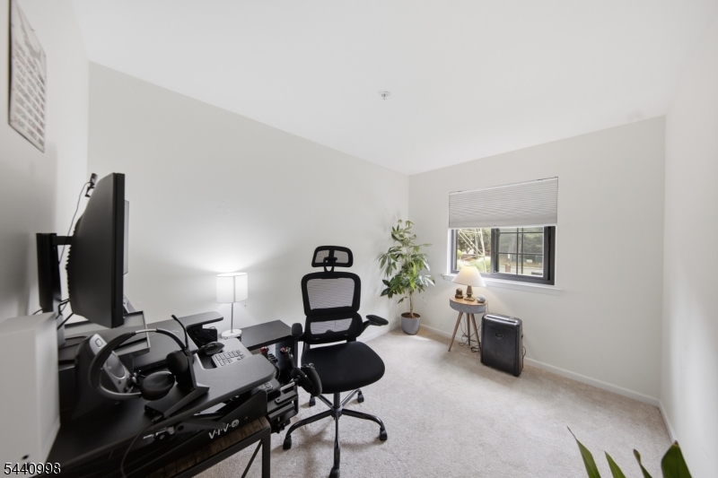 609 Mark Twain Way Mahwah, NJ 07430 - Photo 19 of 40 a living room with furniture and a flat screen tv
