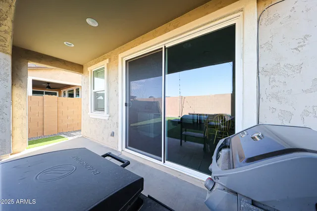 a view of a living room and a balcony