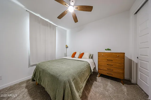 a bedroom with a bed and a cabinets