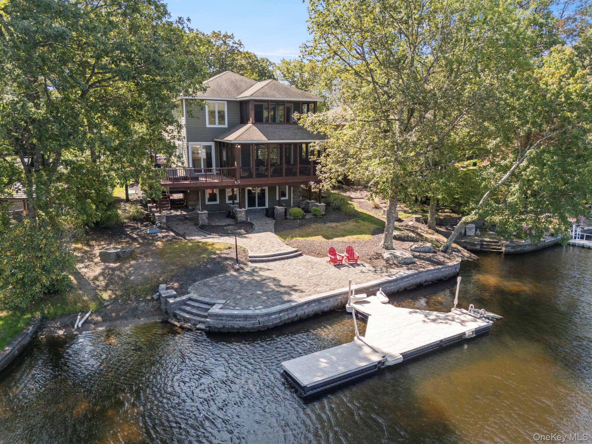 a view of a house with swimming pool and a yard