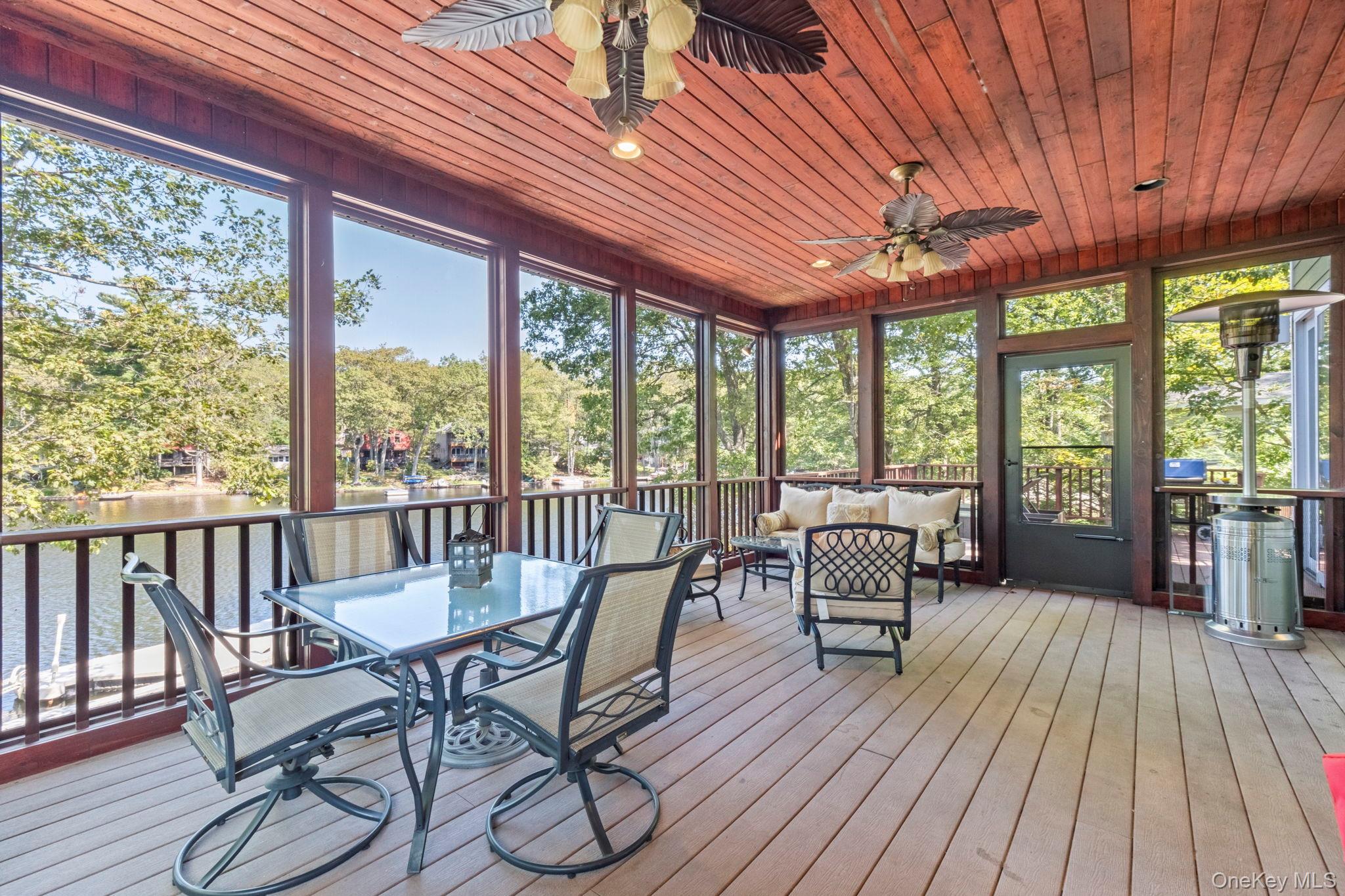 62 Middletown Point Road Rock Hill, NY 12775 - Photo 12 of 42 a dining room with furniture water view and wooden floor