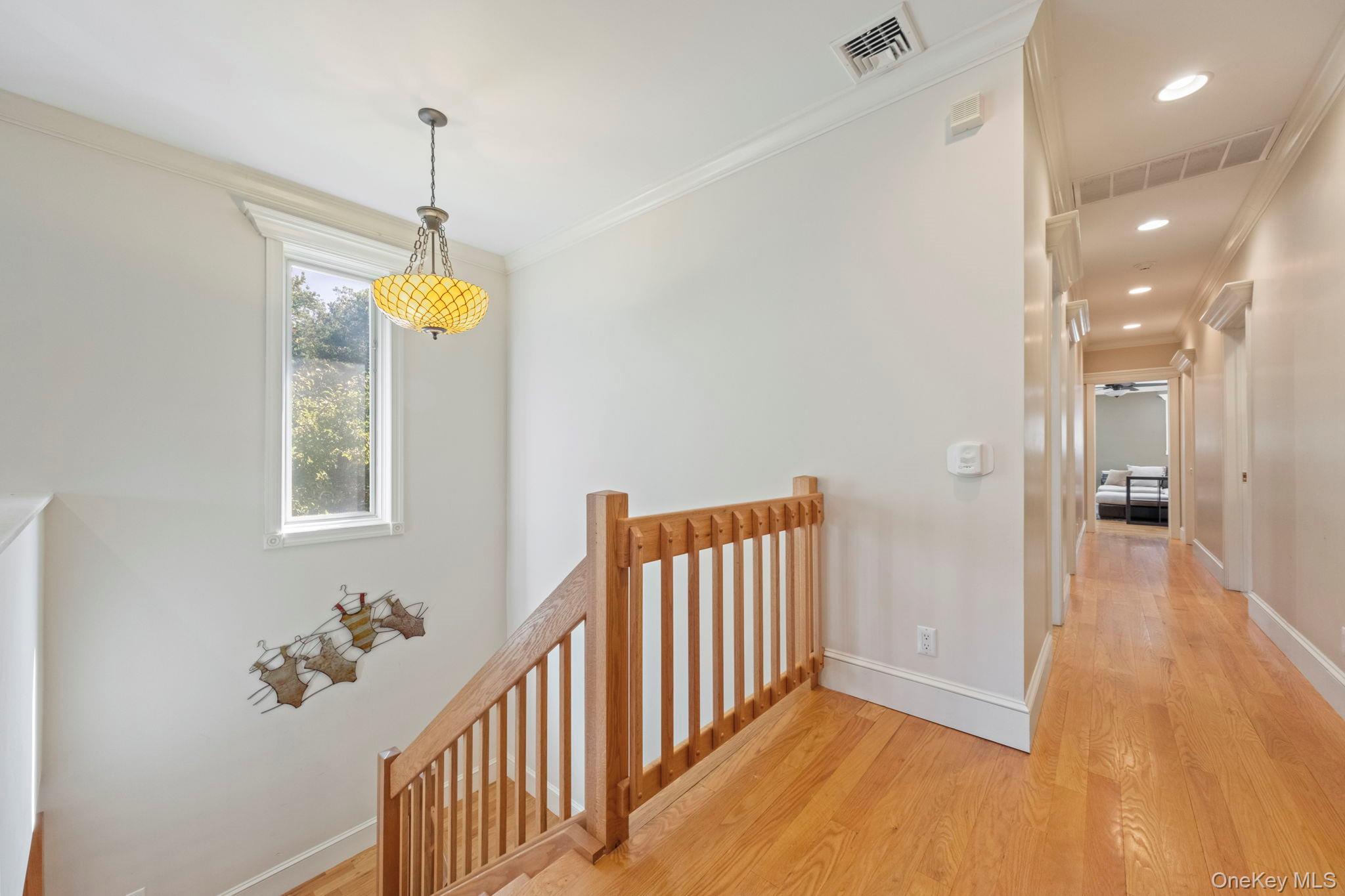 62 Middletown Point Road Rock Hill, NY 12775 - Photo 14 of 42 a view of a hallway to a bedroom with wooden floor and windows
