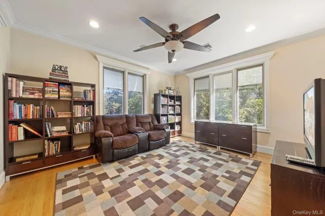 a living room with furniture or window and a flat screen tv