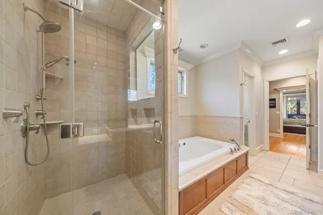 a bathroom with a tub and shower