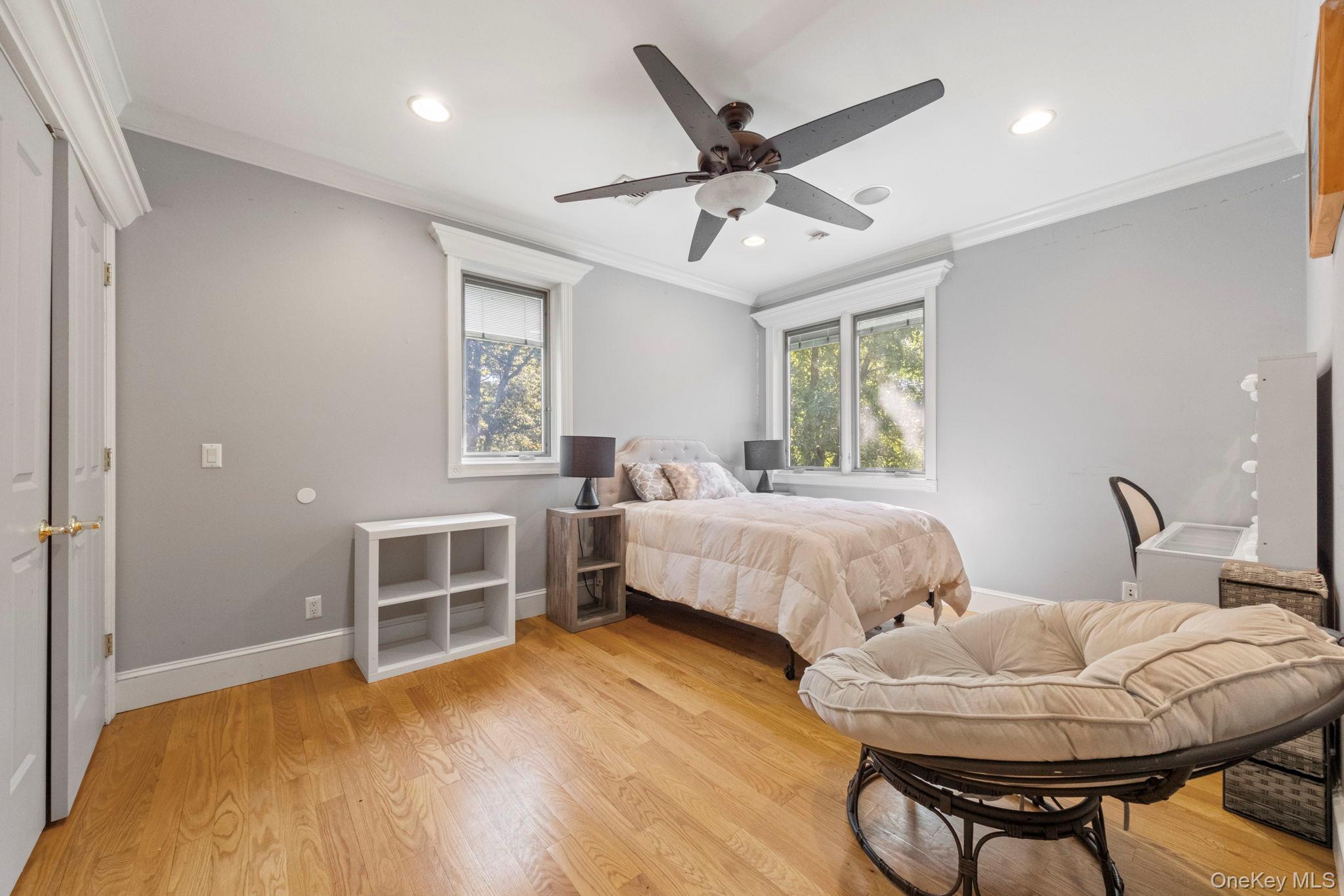 62 Middletown Point Road Rock Hill, NY 12775 - Photo 21 of 42 a spacious bedroom with a bed a chandelier and dresser