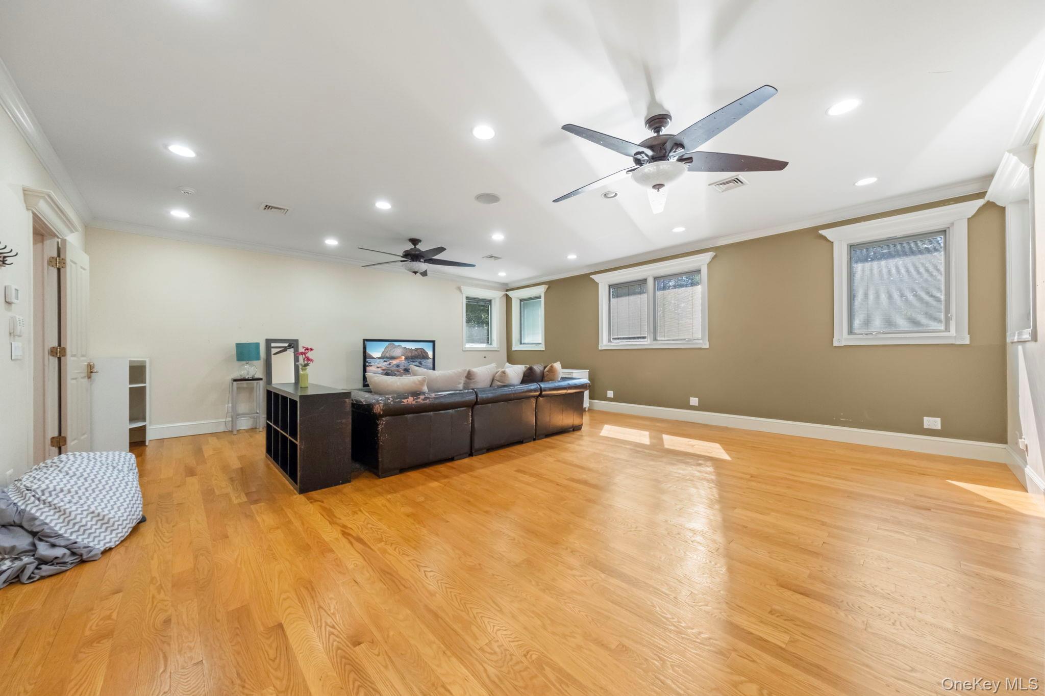 62 Middletown Point Road Rock Hill, NY 12775 - Photo 23 of 42 a large bedroom with a bed and a chandelier