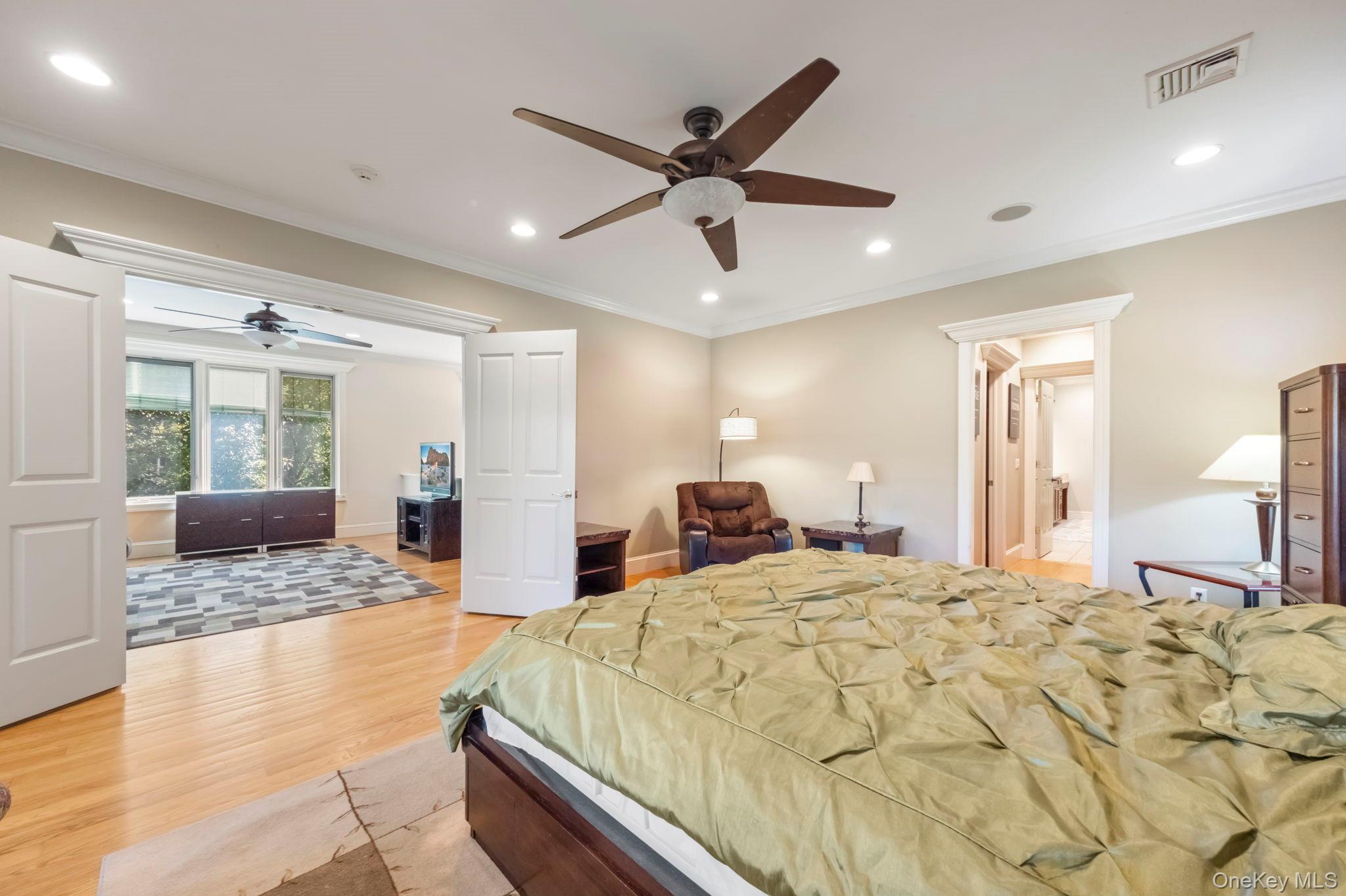 62 Middletown Point Road Rock Hill, NY 12775 - Photo 24 of 42 a large bedroom with a large bed and ceiling fan