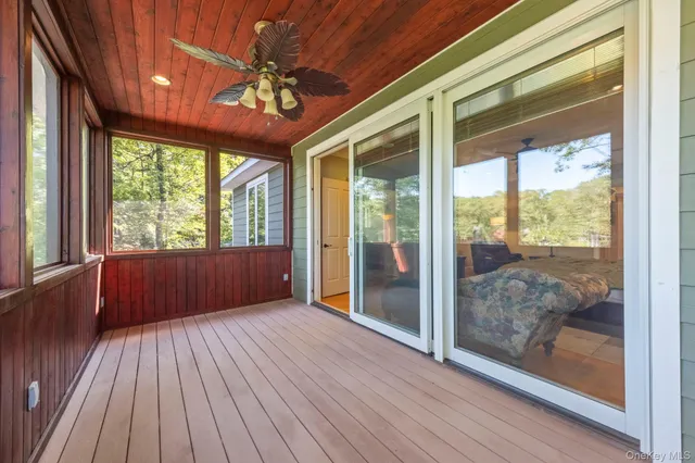 a view of a room with wooden floor and balcony