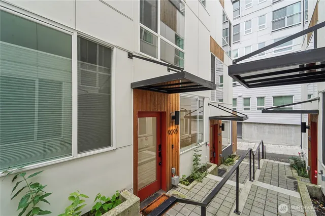 a view of a patio with table and chairs barbeque potted plants