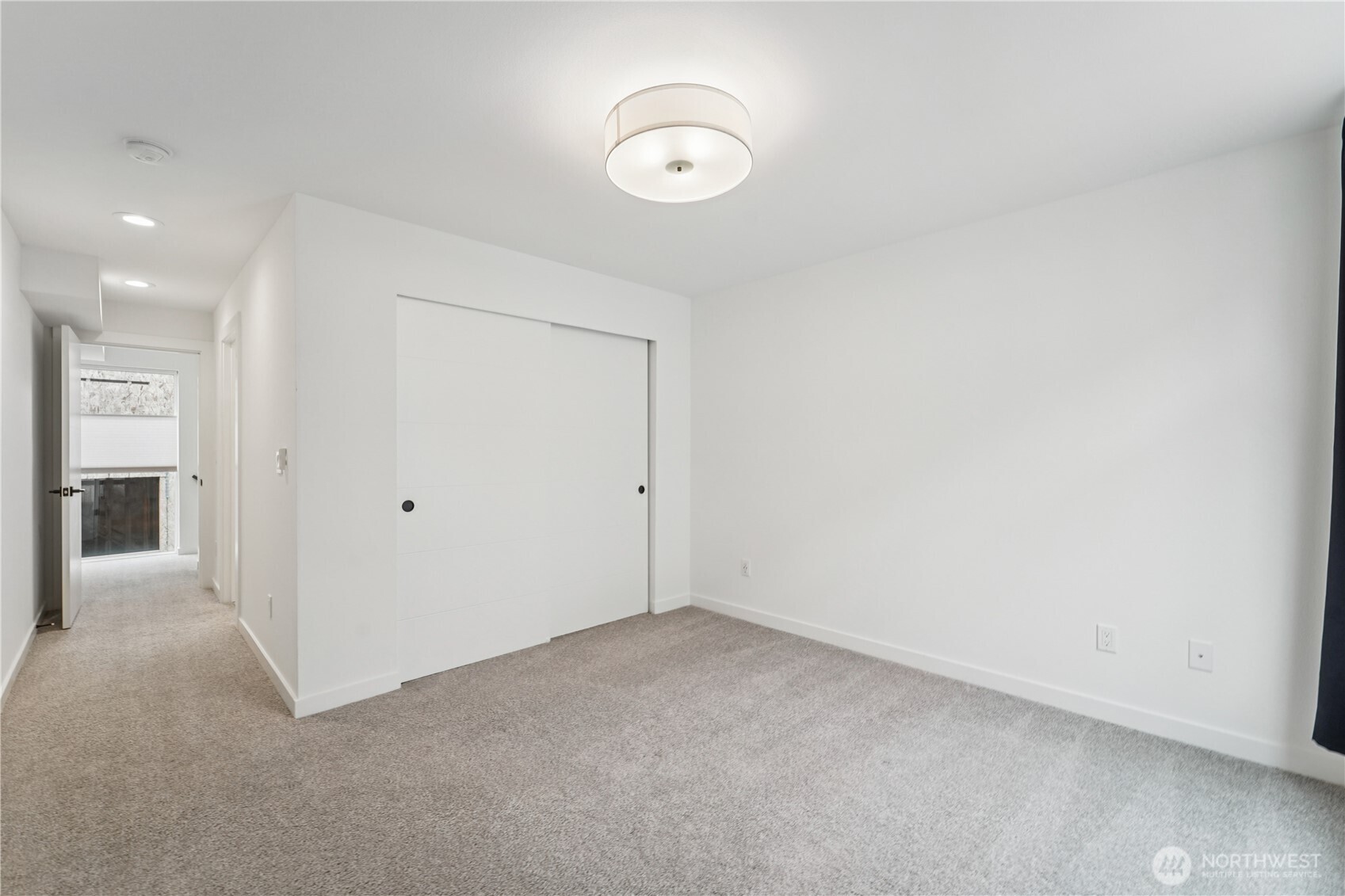 909 Hiawatha Place South, Unit B Seattle, WA 98144 - Photo 15 of 22 an empty room with closet and a chandelier fan