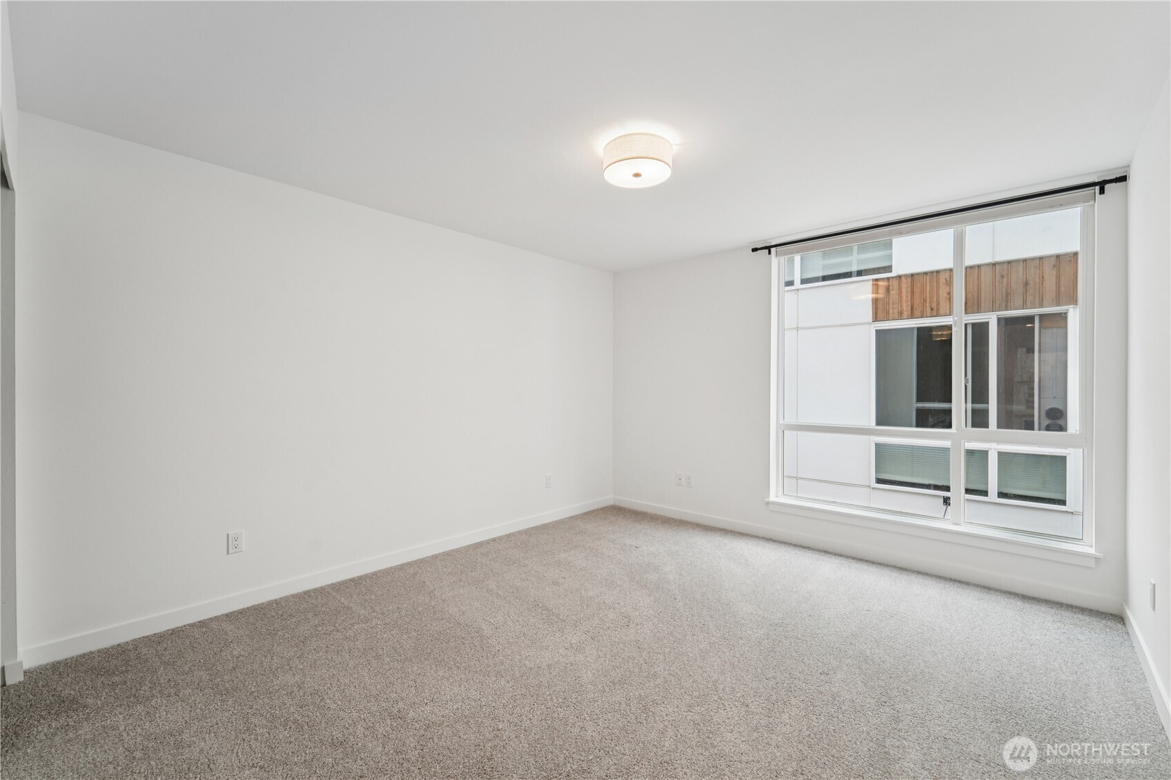 909 Hiawatha Place South, Unit B Seattle, WA 98144 - Photo 16 of 22 a view of an empty room with a window
