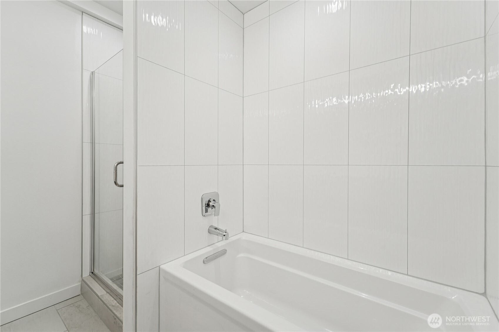 909 Hiawatha Place South, Unit B Seattle, WA 98144 - Photo 18 of 22 a white bath tub sitting next to a white sink and vanity
