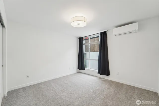 a view of an empty room and window