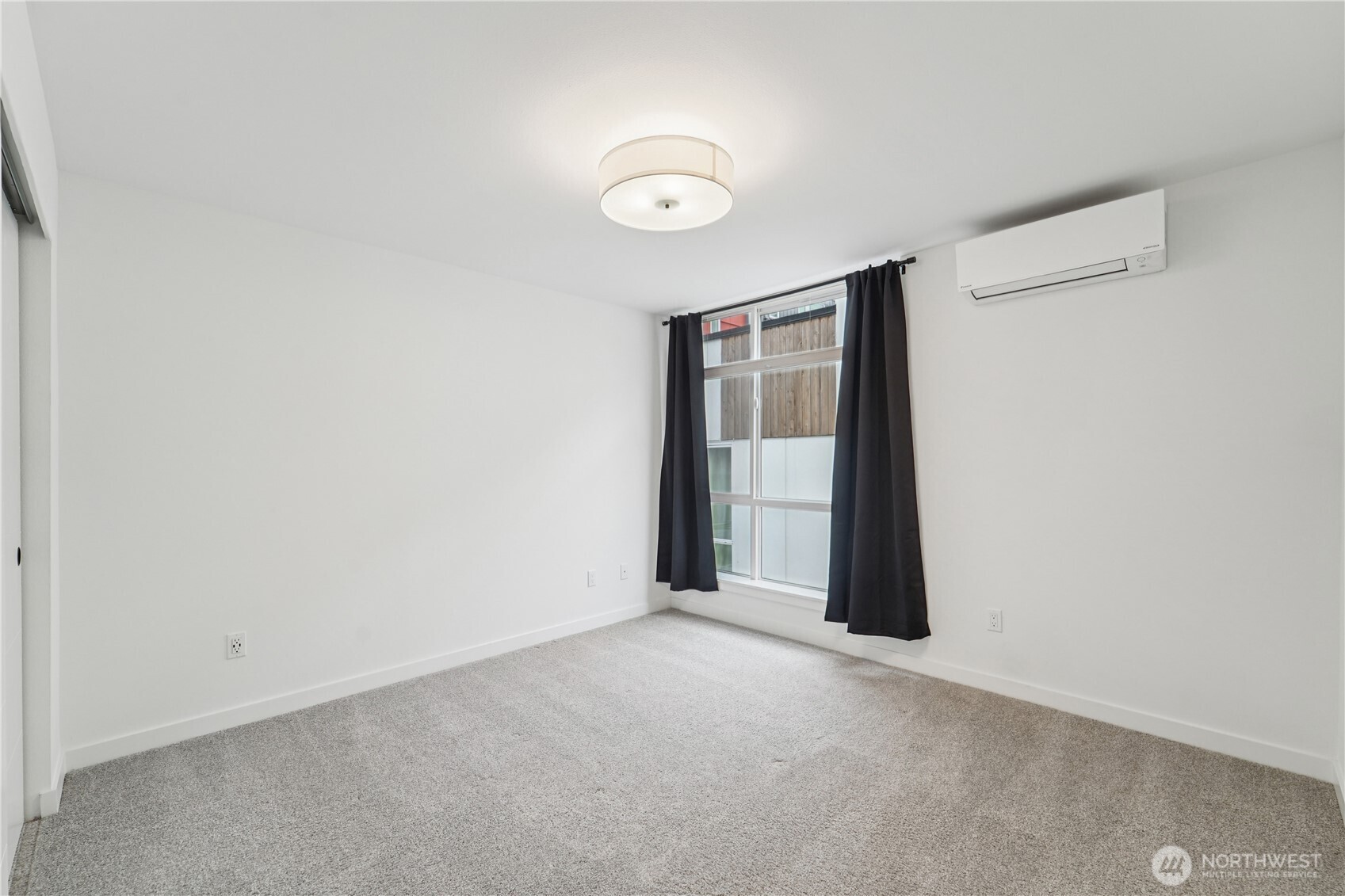 909 Hiawatha Place South, Unit B Seattle, WA 98144 - Photo 20 of 22 a view of an empty room and window