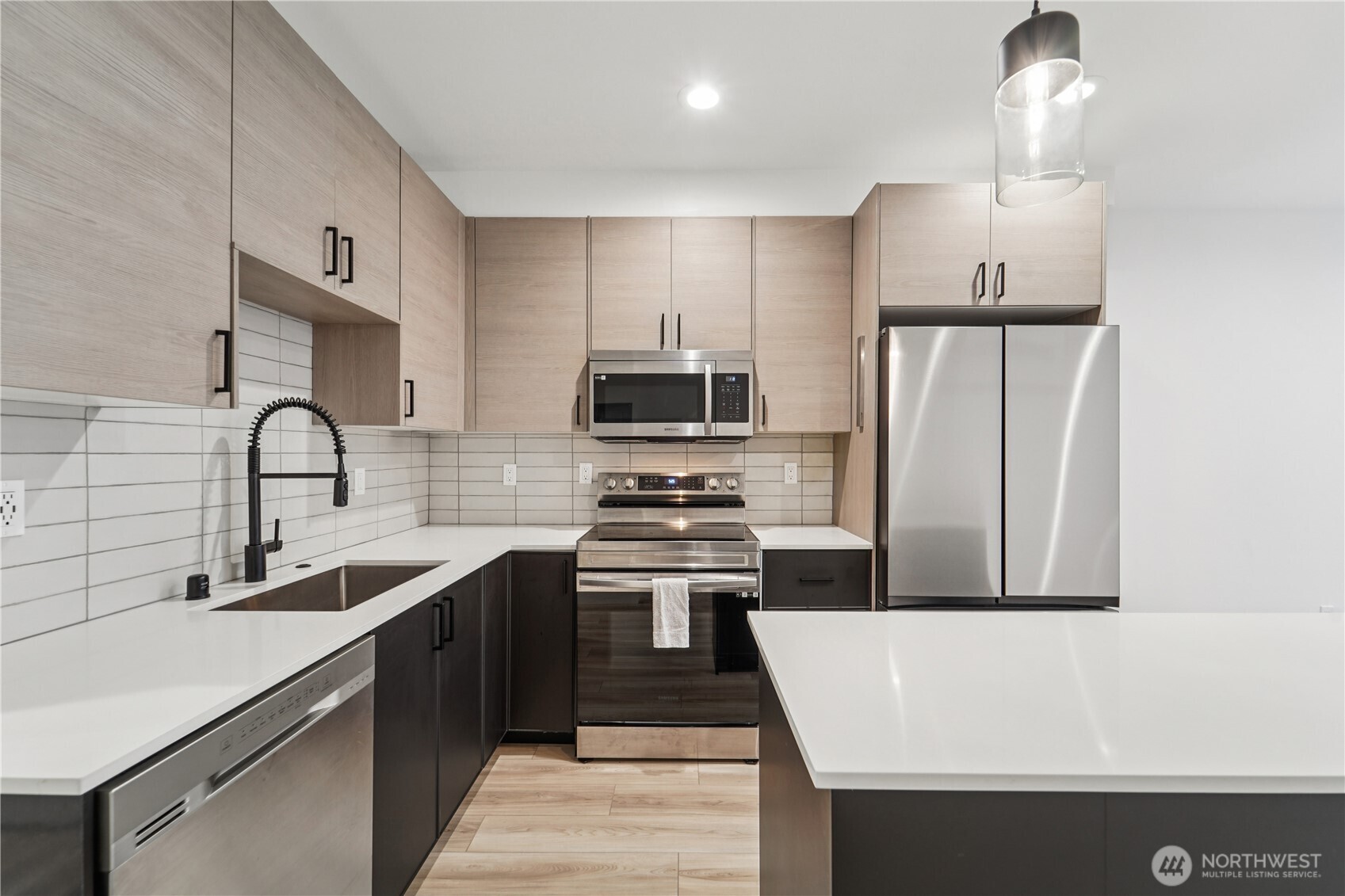 909 Hiawatha Place South, Unit B Seattle, WA 98144 - Photo 9 of 22 a kitchen with a sink a stove and refrigerator