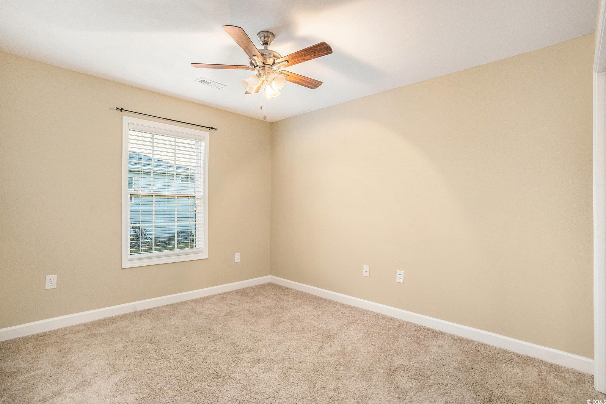 265 Georgia Mae Loop Conway, SC 29527 - Photo 11 of 28 Spare room featuring carpet flooring and a ceiling fan
