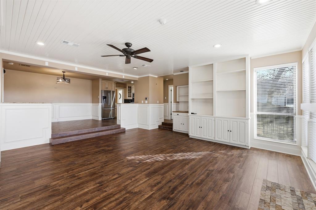 809 Cardinal Circle Bedford, TX 76022 - Photo 20 of 40 Open concept with living room open to kitchen and dining room.