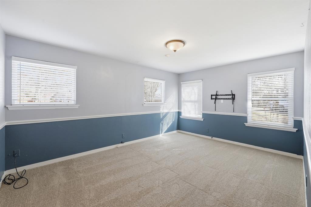809 Cardinal Circle Bedford, TX 76022 - Photo 22 of 40 Bedroom #2 on 1st floor with new carpet.