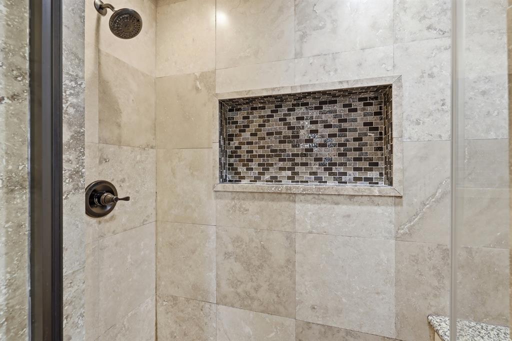 809 Cardinal Circle Bedford, TX 76022 - Photo 31 of 40 Beautiful tile work in primary shower.