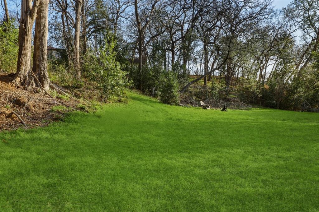 809 Cardinal Circle Bedford, TX 76022 - Photo 5 of 40 Gorgeous backyard with mature trees.