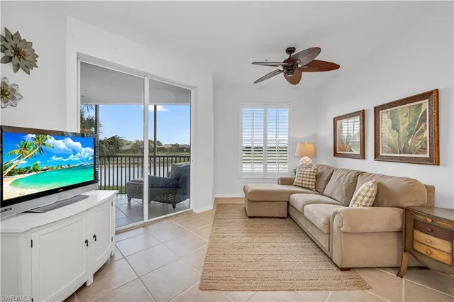 a kitchen with kitchen island a stove a table and chairs in it